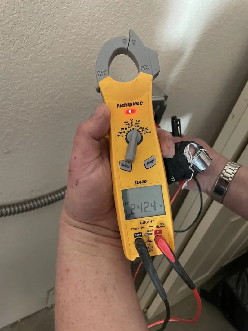 Voltage testing with clamp meter during Outlet Installation in Dover